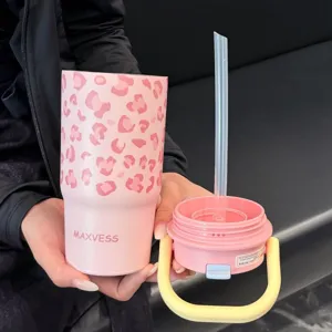Pink leopard print stainless steel insulated tumbler with lid, handle, and straw detail
