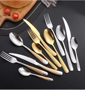 Stainless steel western flatware set with textured handles, elegant gold and silver cutlery for table.