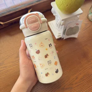 Bouteille isotherme en acier inoxydable avec paille et motifs de chiots mignons pour étudiants.