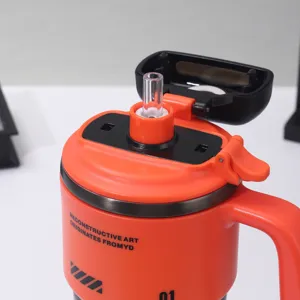 Detail shot of a large capacity insulated straw tumbler in vibrant orange, portable cup design.
