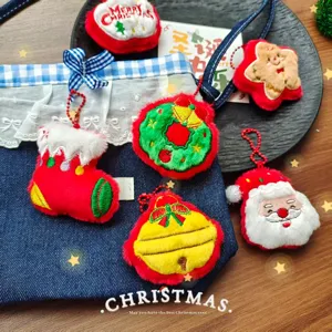 Christmas plush pendant detail shot, cute cartoon doll hanging decoration for holiday.
