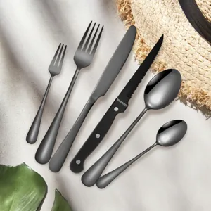 Black stainless steel cutlery set detail showing flatware scene display for modern dining.