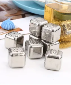 Stainless steel ice cubes reusable metal whiskey stones barware detail view showing chilled metallic cubes.