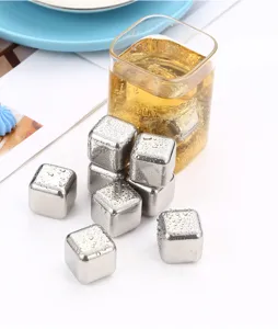 Stainless steel whiskey ice cubes detail shot, showing reusable metal chilling stones in glass.