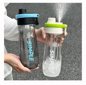 Detail shot of portable spray water bottle with straw, ideal for outdoor sports and daily use.