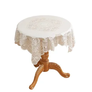 Vintage beigefarbene runde Spitzen-Tischdecke, elegantes Blumenmuster für Heimdekoration.