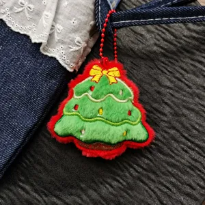 Christmas tree plush pendant detail, red and green festive charm with gold bow, 6.5x7cm size