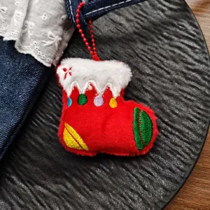 Cute Christmas plush stocking pendant detail view, soft hanging ornament for holiday decor.