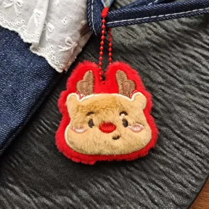 Detailed view of Christmas reindeer plush pendant, cute cartoon embroidery charm for bags.