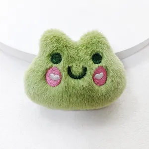 Green frog plush toy brooch detail, cute cartoon stuffed animal accessory for bags and keys.