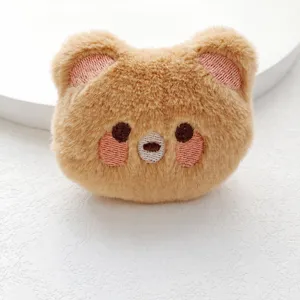Cute brown bear plush toy accessory, soft fluffy fabric, perfect for bag charm or brooch.