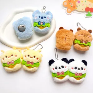 Cute plush animal charms with apron design including koala capybara panda and bee styles.