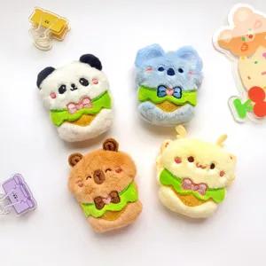 Cute cartoon animal plush pendant detail, featuring panda, koala and capybara designs.
