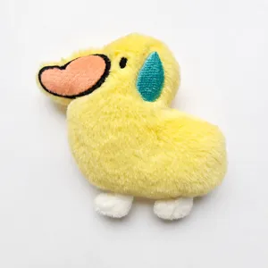 Yellow duck plush toy detail view featuring cute heart beak and blue sweat drop embroidery.