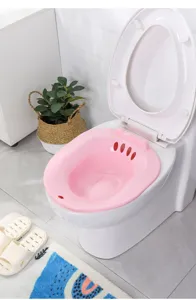 Pink plastic sitz bath basin for postpartum care, pregnant women and hemorrhoid relief, detail view.