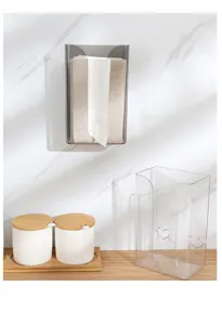 Gedetailleerd overzicht van transparante wand-tissuebox en bureau-opbergorganizer.