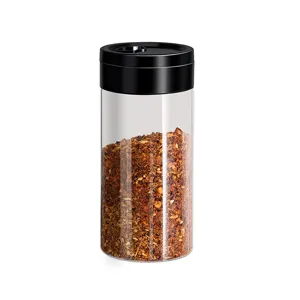 Clear spice shaker bottle with black lid for kitchen cooking, barbecue and seasoning storage.