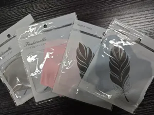 Detail view of ice silk sunscreen face masks in packaging, offering full face and UV protection.