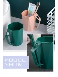 Geometric plastic toothbrush cup with handle, modern minimalist home bathroom rinsing cup detail.