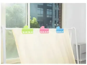 Winddichte kledingknijpers met zeven gaten bevestigen wasgoed stevig aan het droogrek.
