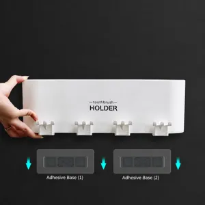 Punch-free wall mounted toothbrush holder with hooks and adhesive backing for easy bathroom use.
