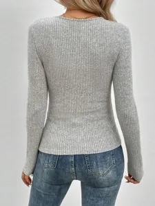 Women's grey ribbed long-sleeve knit top, back view detail showcasing textured fabric.