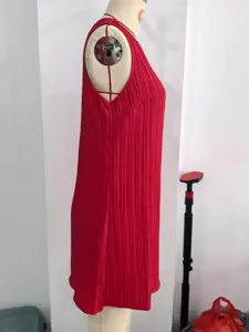 Red sleeveless pleated mini dress, chic casual summer wear with elegant round neck.
