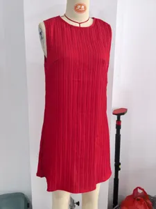 Elegant red sleeveless pleated mini dress with a chic round neckline for summer wear.