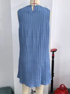 Blue sleeveless pleated midi dress, casual solid color summer dress, back button detail.