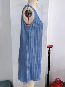 Light blue sleeveless pleated dress with a round neck and casual short length for summer wear.