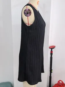 Classic black sleeveless pleated dress with round neck for elegant spring and summer wear.