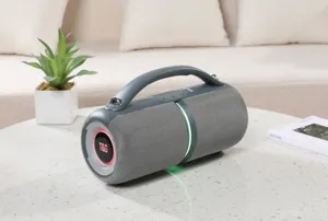 Detailed view of the portable bluetooth speaker with handle and RGB lighting on a table.