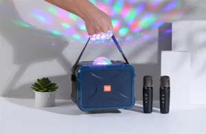 Portable karaoke Bluetooth speaker detail with colorful disco light, dual wireless microphones.