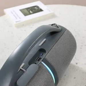 Portable Bluetooth speaker detail showing the robust handle, control buttons, and ports.