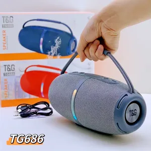 Portable wireless Bluetooth speaker details, handheld view showing portable fabric handle and RGB light.