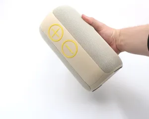 Portable wireless Bluetooth speaker with fabric mesh and high visibility buttons for outdoor use.