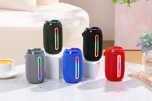 Altavoz Bluetooth inalámbrico portátil con luz LED colorida, caja de graves cilíndrica.