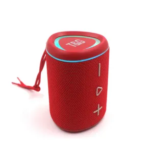 Detailed view of portable red Bluetooth speaker with LED colorful lights and hanging strap.