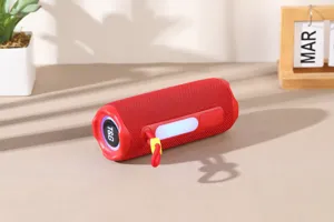 Portable outdoor RGB Bluetooth speaker, cylindrical red design with strap and card slot.