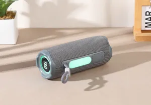 Portable outdoor wireless Bluetooth speaker with RGB lights, fabric mesh and deep bass.