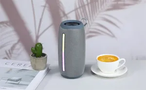 Portable wireless bluetooth speaker with colorful LED light strip and convenient handle strap.
