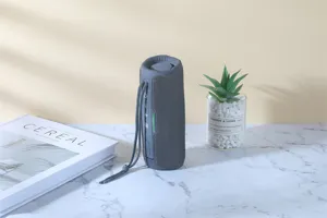 Portable waterproof bluetooth speaker with deep bass, TWS connection and colorful LED lights.