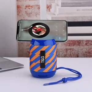Portable Bluetooth speaker detail view showing blue and orange woven mesh texture.