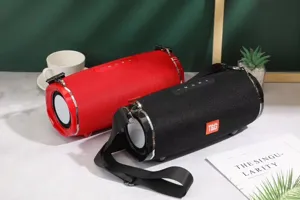 Portable cylinder bluetooth speaker with dual passive radiators and strap for outdoor use.
