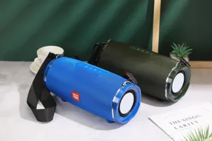 Portable bluetooth speaker with fabric mesh design, waterproof outdoor heavy bass stereo.