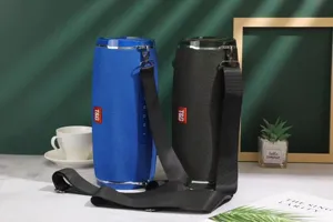 Portable waterproof wireless bluetooth speaker with fabric mesh, deep bass and shoulder strap.