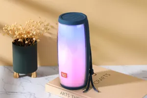 Enceinte Bluetooth sans fil portable avec lumières LED colorées et design cylindrique.