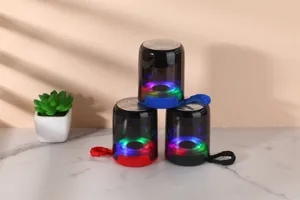 Portable wireless Bluetooth speaker with colorful LED lights, transparent shell, and bass sound.