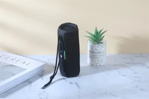 Portable waterproof bluetooth speaker with deep bass and colorful lights for outdoor use.