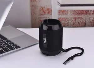 Close-up of the portable wireless Bluetooth speaker featuring black mesh fabric and phone slot.